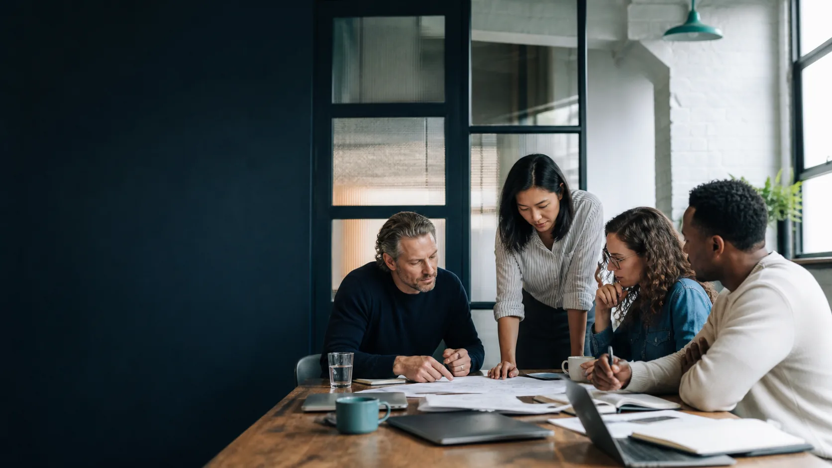 A business leadership team planning together around a shared table